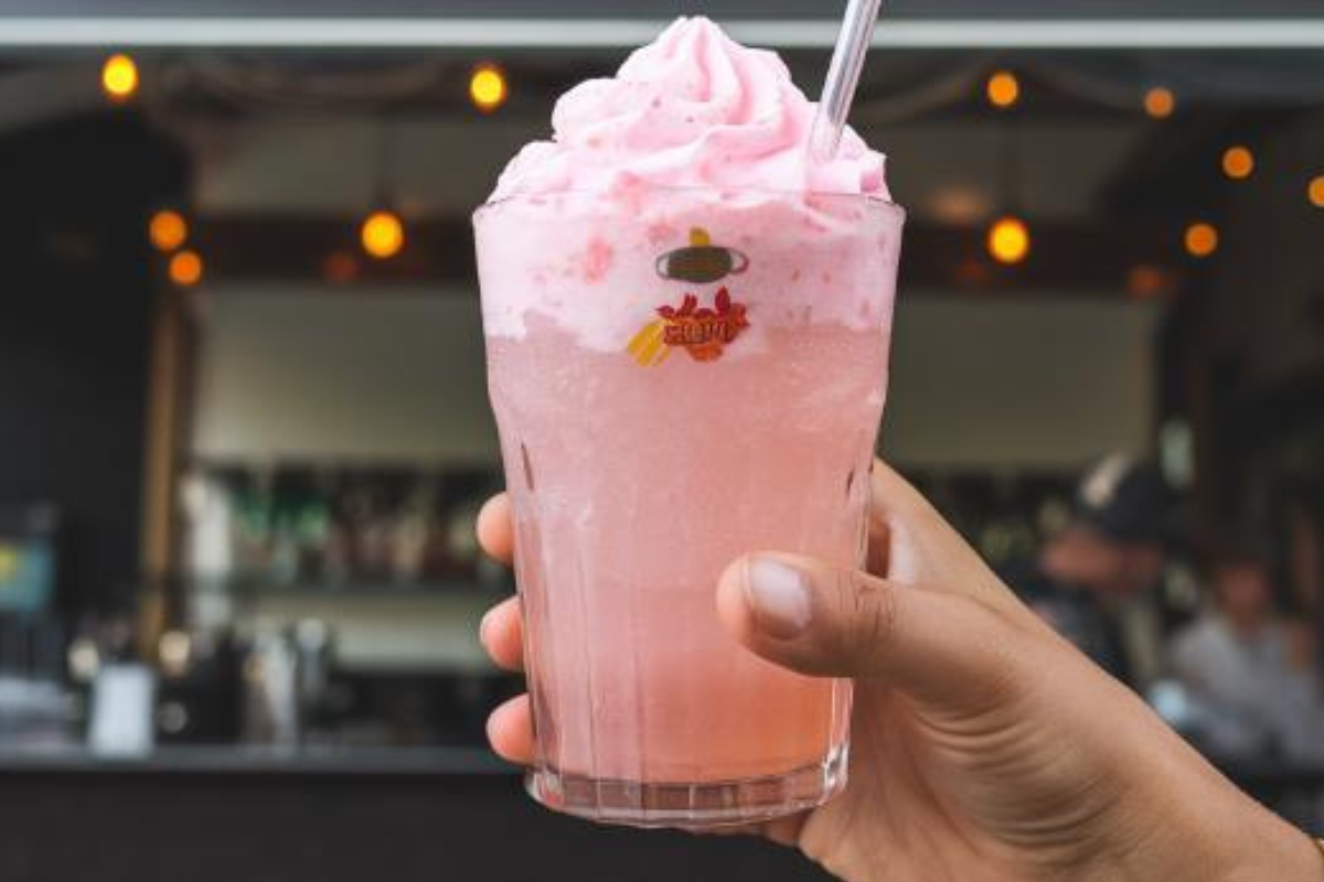 A colorful assortment of alcoholic slushies in various flavors, served in frosty glasses.