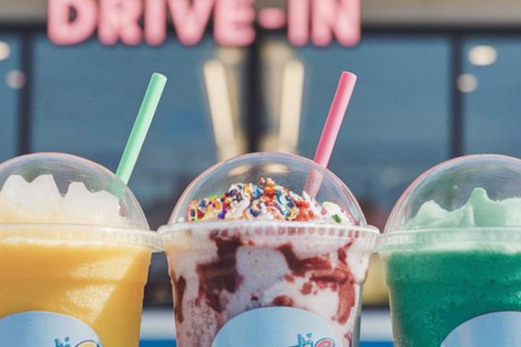 A variety of colorful Sonic slushies in different flavors, served in Sonic Drive-In cups.